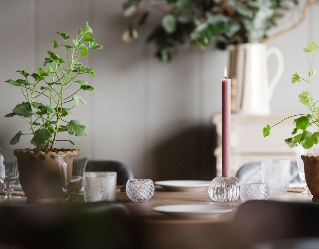 Table setting and potted plants at Barnsgrove, Hampshire