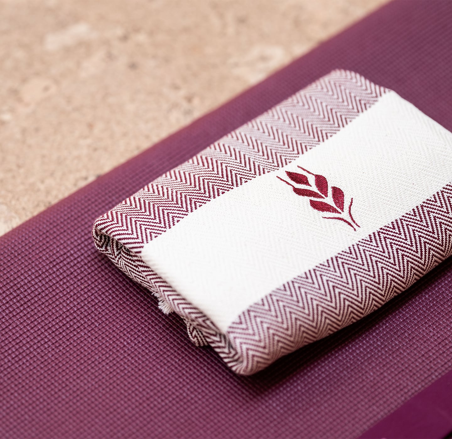 Barnsgrove Fitness and Wellness. Branded towel on a yoga mat.