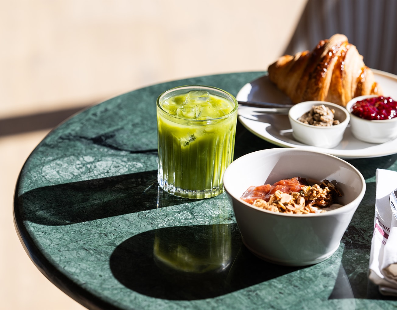 Barnsgrove Palmers. A green marble table with delicious juice and breakfast items.