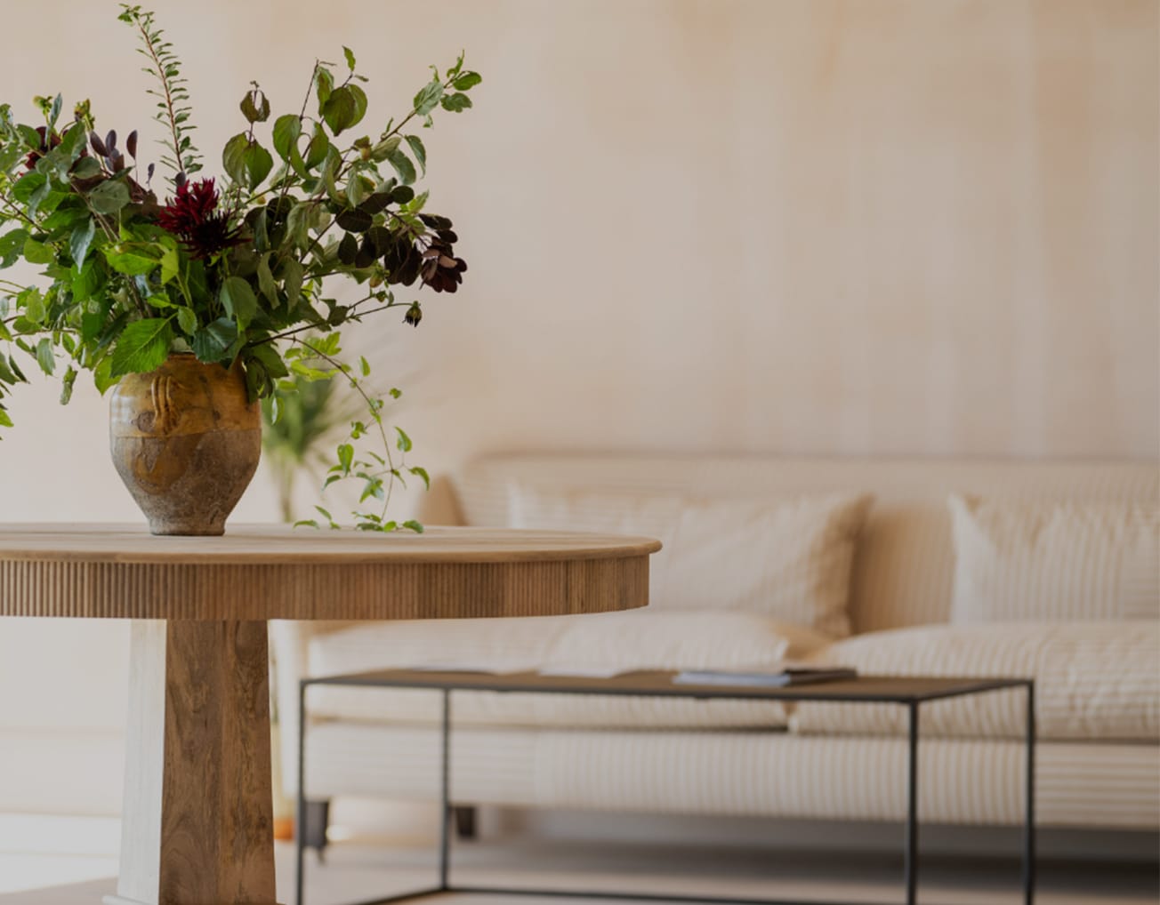 Barnsgrove Private Office. A beautiful sofa and coffee table with a side table and plants.